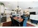 Open living space with dining area, kitchen with stainless appliances, and living room at 2188 Cumberland Hill Dr, Henderson, NV 89052