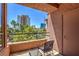 Balcony featuring a small table and chair set and views of the city skyline at 220 E Flamingo Rd # 317, Las Vegas, NV 89169
