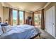 Bright bedroom with a large window, comfortable bed, and access to the balcony at 220 E Flamingo Rd # 317, Las Vegas, NV 89169