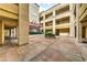 Beautiful outdoor courtyard with a water feature and desert landscaping around the walkways at 220 E Flamingo Rd # 317, Las Vegas, NV 89169