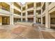 Courtyard featuring earth tone pavers and pillars and multiple entry ways at 220 E Flamingo Rd # 317, Las Vegas, NV 89169