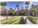 Exterior shot of the clubhouse featuring steps, pillars, landscaping, and an archway at 220 E Flamingo Rd # 317, Las Vegas, NV 89169
