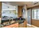 Kitchen counter with views of dining area, black countertops and stainless steel appliances at 220 E Flamingo Rd # 317, Las Vegas, NV 89169