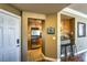 Cozy kitchen entrance featuring stainless steel appliances, tiled floors, and a breakfast bar at 220 E Flamingo Rd # 317, Las Vegas, NV 89169