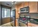 Stylish kitchen with stainless steel appliances and light wood cabinets providing ample storage at 220 E Flamingo Rd # 317, Las Vegas, NV 89169