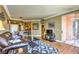 Comfortable living room featuring a decorative rug, access to the balcony, and ample seating at 220 E Flamingo Rd # 317, Las Vegas, NV 89169