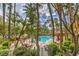 Scenic elevated view of pool surrounded by lush greenery and palm trees at 220 E Flamingo Rd # 317, Las Vegas, NV 89169