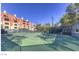 Bright and pristine tennis court surrounded by lush greenery, ready for a match at 220 E Flamingo Rd # 317, Las Vegas, NV 89169