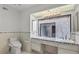 Bright bathroom featuring dual sinks, decorative tile accents, and ample counter space at 2558 La Fortuna Ave, Las Vegas, NV 89121