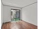 Bright bedroom features sliding glass doors with a view of a charming courtyard at 2558 La Fortuna Ave, Las Vegas, NV 89121