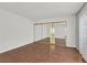 Spacious bedroom with wood floors and mirrored closet, offering lots of storage space at 2558 La Fortuna Ave, Las Vegas, NV 89121