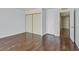 Bedroom with hardwood floors and closet with sliding doors for convenient storage at 2558 La Fortuna Ave, Las Vegas, NV 89121