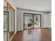 Well-lit bedroom with hardwood flooring and sliding glass doors leading to patio at 2558 La Fortuna Ave, Las Vegas, NV 89121