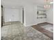 Inviting dining area showcasing stylish tile flooring, a modern chandelier, and an open layout to the kitchen at 2558 La Fortuna Ave, Las Vegas, NV 89121