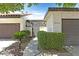 Welcoming entryway with secure gate and well maintained desert landscaping at 2558 La Fortuna Ave, Las Vegas, NV 89121