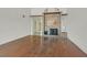 Living room with hardwood floors and a tiled fireplace at 2558 La Fortuna Ave, Las Vegas, NV 89121
