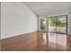 Bright living room with wood floors, large sliding glass doors, and abundant natural light at 2558 La Fortuna Ave, Las Vegas, NV 89121