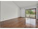Bright living room with wood floors, large sliding glass doors, and abundant natural light at 2558 La Fortuna Ave, Las Vegas, NV 89121
