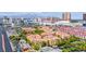 View of the complex, including buildings, roads, parking and proximity to the city skyline at 270 E Flamingo Rd # 106, Las Vegas, NV 89169