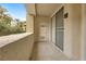 Private balcony featuring neutral colors, tile flooring, and a security gate at 270 E Flamingo Rd # 106, Las Vegas, NV 89169