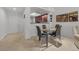 Contemporary dining area featuring seating for four and a view of the kitchen, perfect for casual meals at 270 E Flamingo Rd # 106, Las Vegas, NV 89169
