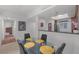 Elegant dining space featuring a glass table, modern chairs and access to the kitchen at 270 E Flamingo Rd # 106, Las Vegas, NV 89169