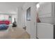 View of the hallway with laundry closet, living room, and entertainment area for a functional layout at 270 E Flamingo Rd # 106, Las Vegas, NV 89169