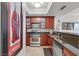 Modern kitchen with stainless steel appliances, granite counters, and tiled flooring for easy maintenance at 270 E Flamingo Rd # 106, Las Vegas, NV 89169