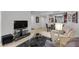 Spacious living area with modern entertainment setup, adjacent dining area with sleek table and chairs at 270 E Flamingo Rd # 106, Las Vegas, NV 89169
