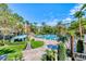 Expansive pool area surrounded by palm trees and resort-style amenities at 270 E Flamingo Rd # 106, Las Vegas, NV 89169