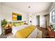 Bright staged bedroom featuring stylish decor, neutral paint, and plush carpeting at 3135 La Mesa Dr, Henderson, NV 89014