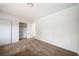 Spacious bedroom featuring neutral paint, plush carpeting and closet space at 3135 La Mesa Dr, Henderson, NV 89014