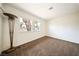 Neutral bedroom featuring plush carpeting and bright double-hung windows at 3135 La Mesa Dr, Henderson, NV 89014