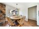 Dining room featuring wood-look floors and stylish light fixtures at 3135 La Mesa Dr, Henderson, NV 89014