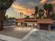 Charming single-story home with desert landscaping, a tile roof, and an attached garage at 3135 La Mesa Dr, Henderson, NV 89014