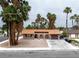 Attractive single-level home with terracotta roof, arched front porch, easy access garage and desert landscaping at 3135 La Mesa Dr, Henderson, NV 89014