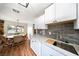 Modern kitchen with a stainless steel sink and white cabinets at 3135 La Mesa Dr, Henderson, NV 89014