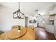 Modern kitchen featuring white cabinets, updated appliances, and stylish lighting at 3135 La Mesa Dr, Henderson, NV 89014