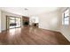 Spacious living room featuring hardwood floors and a stone fireplace at 3135 La Mesa Dr, Henderson, NV 89014