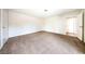 Expansive living room featuring neutral paint and plush carpeting at 3135 La Mesa Dr, Henderson, NV 89014