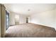 Spacious carpeted main bedroom with large sliding glass doors at 3135 La Mesa Dr, Henderson, NV 89014