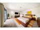 Bedroom with modern furniture, art, and sliding glass doors at 3135 La Mesa Dr, Henderson, NV 89014