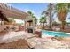 Enjoy outdoor living with a sparkling pool, ample patio space, and lush landscaping at 3135 La Mesa Dr, Henderson, NV 89014
