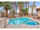 Enjoy the backyard with its sparkling pool, hot tub and lush, tropical landscaping at 3135 La Mesa Dr, Henderson, NV 89014