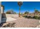 Backyard featuring desert landscaping, a small patio, and a privacy wall at 3141 Diamond Crest Ln, Henderson, NV 89052