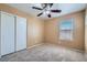 Bedroom featuring neutral carpet, sliding-door closet, and a ceiling fan at 3141 Diamond Crest Ln, Henderson, NV 89052