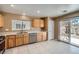 The well lit kitchen offers stainless steel appliances and backyard access at 3141 Diamond Crest Ln, Henderson, NV 89052