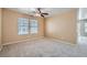 Neutral living room features carpet, ceiling fan, and windows with blinds at 3141 Diamond Crest Ln, Henderson, NV 89052