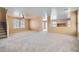 Neutral living room features carpet, stairs, and windows with blinds at 3141 Diamond Crest Ln, Henderson, NV 89052