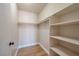Walk-in closet featuring a rod and shelves for organization and wood floors at 3151 Soaring Gulls Dr # 2050, Las Vegas, NV 89128